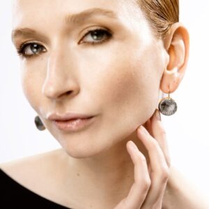 dark radial porcelain earrings with gold mamutaki handcrafted front view