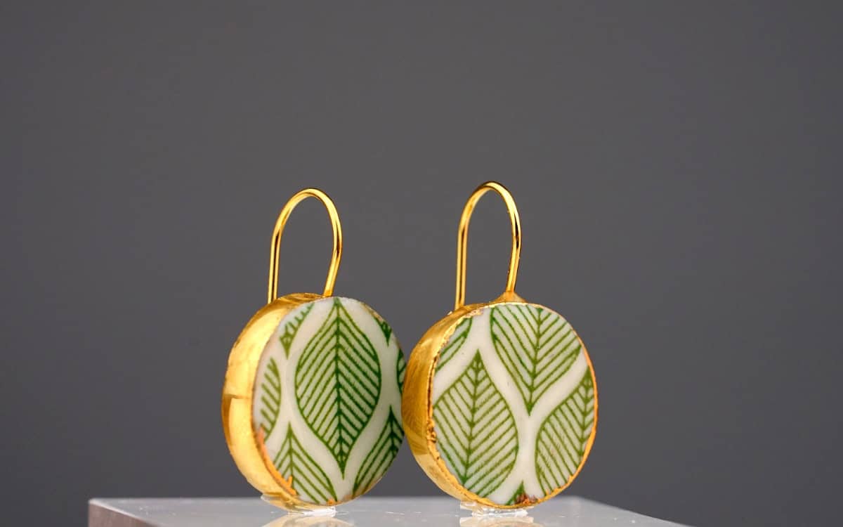 green whispers porcelain earrings with gold mamutaki handcrafted double front view