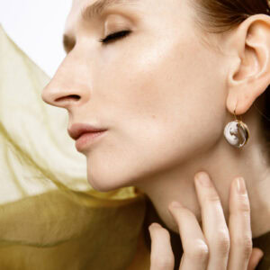 White round porcelain earring White Gold 53. Finest 24-karat gold. A unique handmade piece. Sustainably crafted in the heart of Europe.